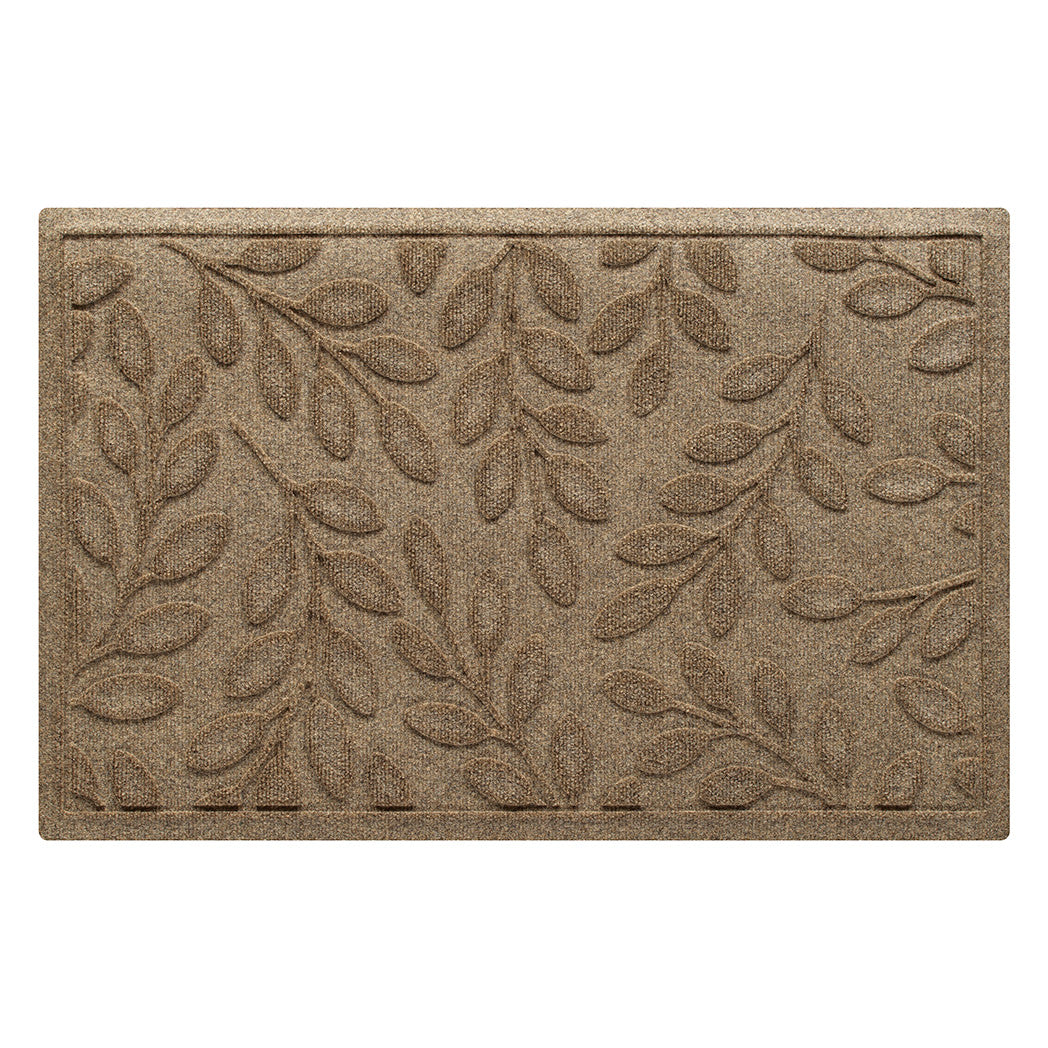 Incredibly durable genuine WaterHog doormat in botanical leafy pattern made with eco-friendly materials in a tan/beige color.