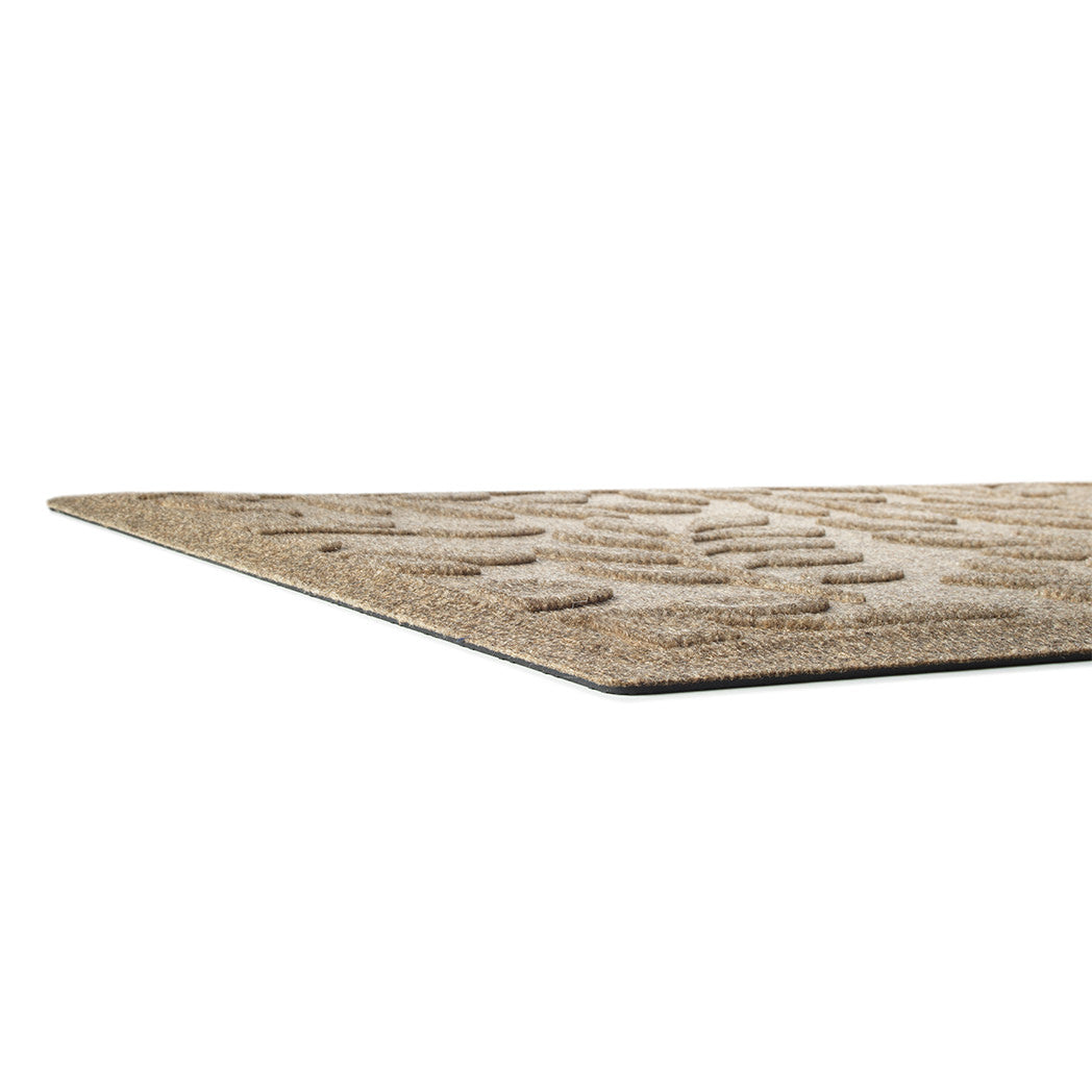 Low-profile designed WaterHog doormat with recycled PET surface and durable rubber backing in a beige/tan color.