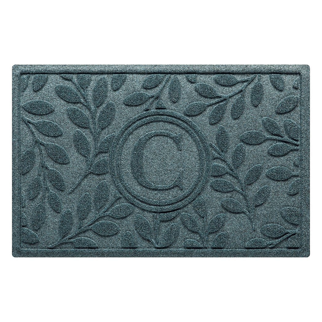 Monogrammed WaterHog indoor/outdoor all-weather doormat with beautiful botanical design surrounding the centered monogram in a blue/green/grey color.