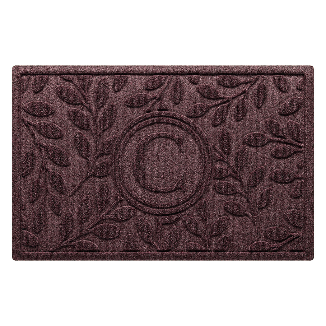 deep burgundy red wine colored WaterHog doormat with a monogrammed letter surrounded by beautiful foliage bi-level design made in the USA with recycled materials.