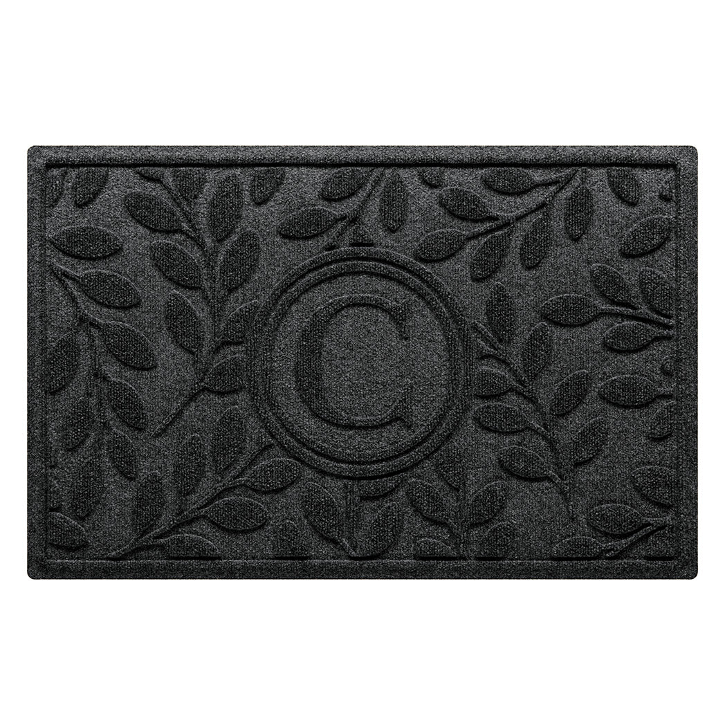 Monogrammed WaterHog all-weather doormat with botanical leafy design on a surface made of recycled PET and backed with durable rubber.