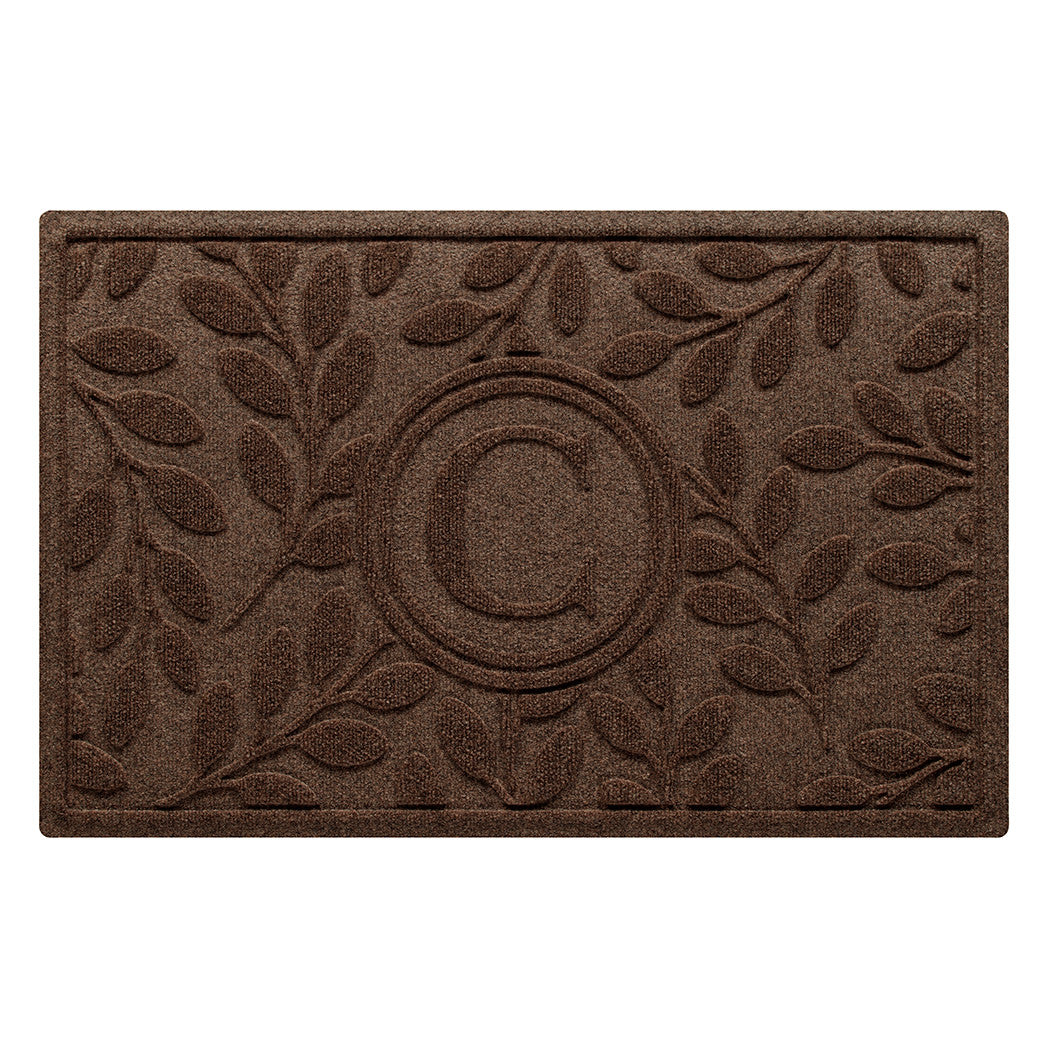 Deep brown classic WaterHog all-weather doormat with a bi-level botanical design surrounding a monogrammed letter in the center for a touch of personalization. Perfect for inviting guests into your home while also protecting your floors.