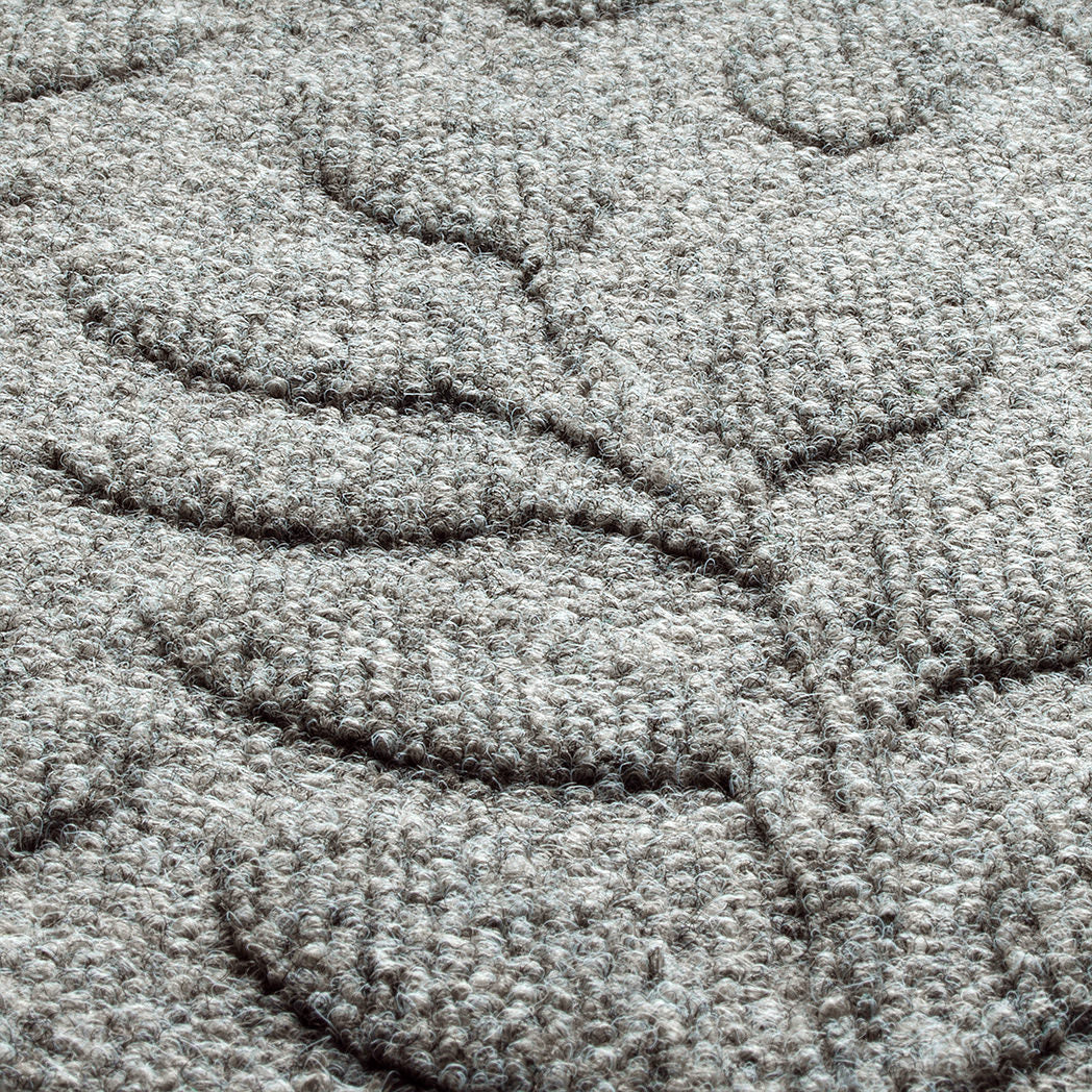 Close-up of light grey PET fiber surface of a genuine WaterHog doormat. Bi-level design perfect for trapping dirt and debris.