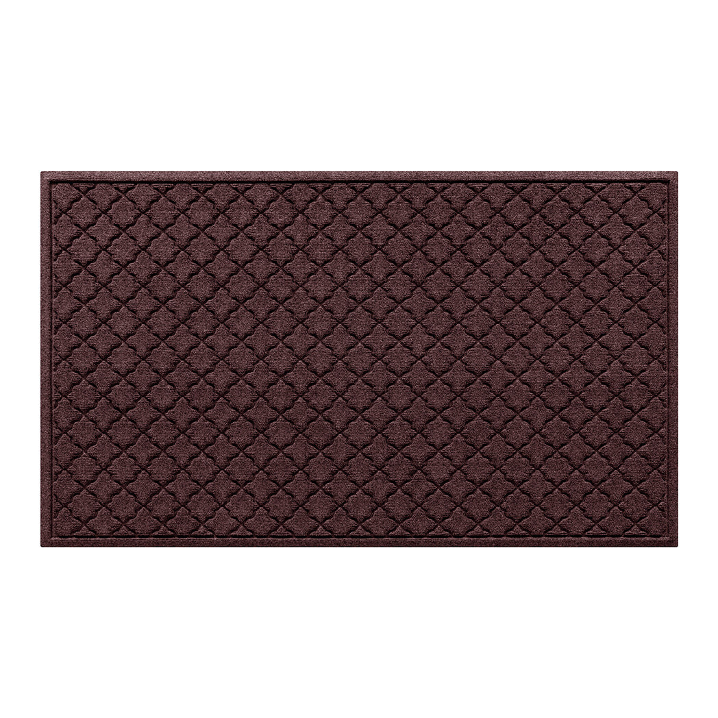 Overhead of a large Cordova all-weather door mat with a deep wine red repeating quatrefoil, bi-level design.