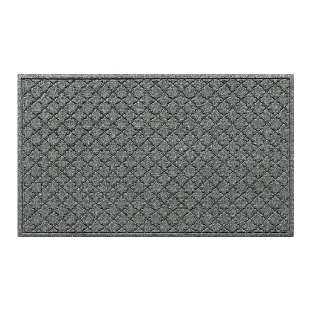 WaterHog 3x5 indoor/outdoor doormat in a light grey surface and repeating quatrefoil pattern.