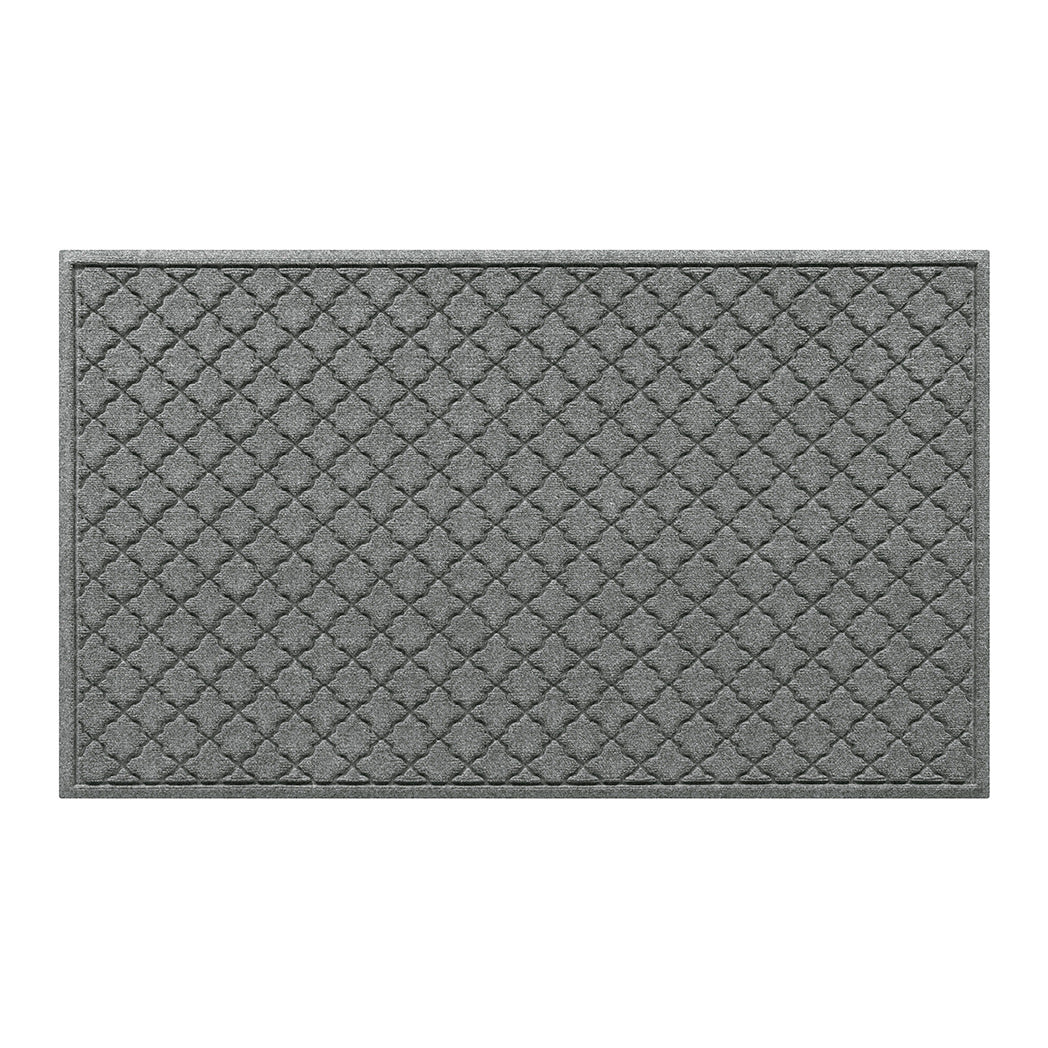 WaterHog 3x5 indoor/outdoor doormat in a light grey surface and repeating quatrefoil pattern.