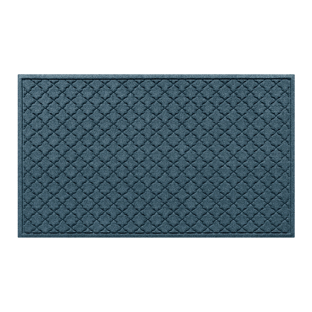 Overhead of a large Cordova outdoor door mat with a relaxed blue repeating quatrefoil pattern.
