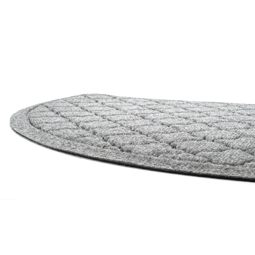 A close-up of Cordova's half-round doormat's low-profile and bi-level design in the color camel.
