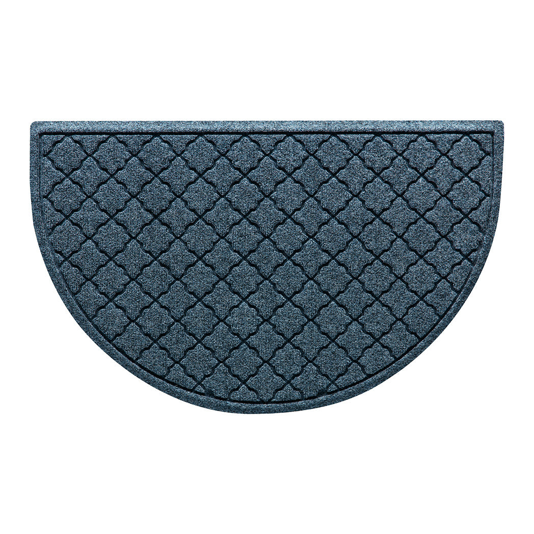 Overhead of a half-round Cordova doormat with a relaxed blue repeating quatrefoil pattern.