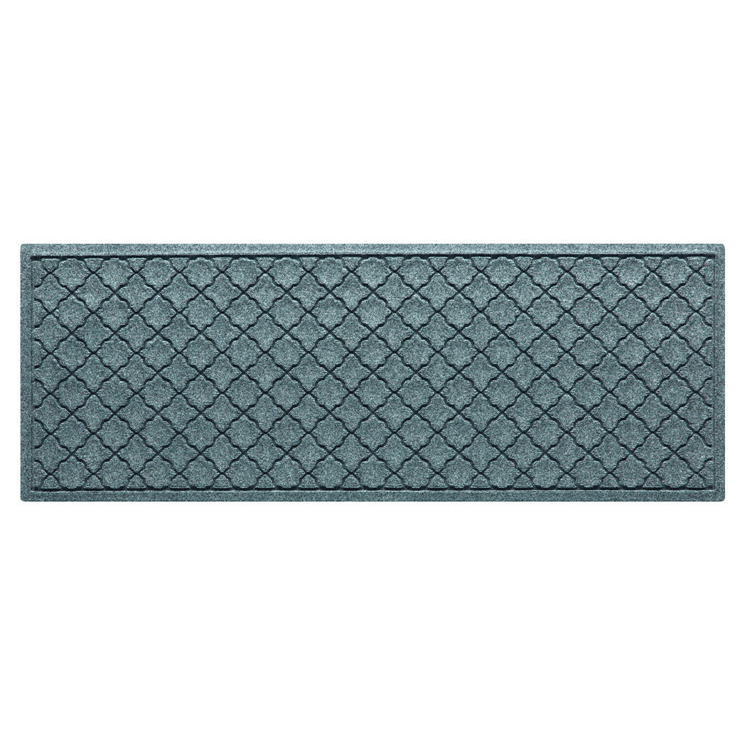 Overhead of a small Cordova WaterHog outdoor runner in a light blue/grey surface and repeating quatrefoil pattern.