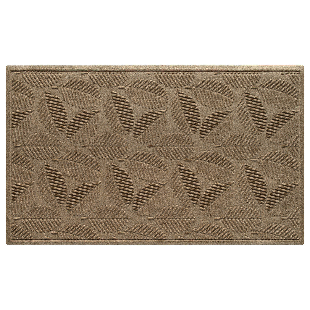 An OG WaterHog 3x5 indoor/outdoor doormat in a light tan leafy design, eco-friendly surface, and durable rubber backing.