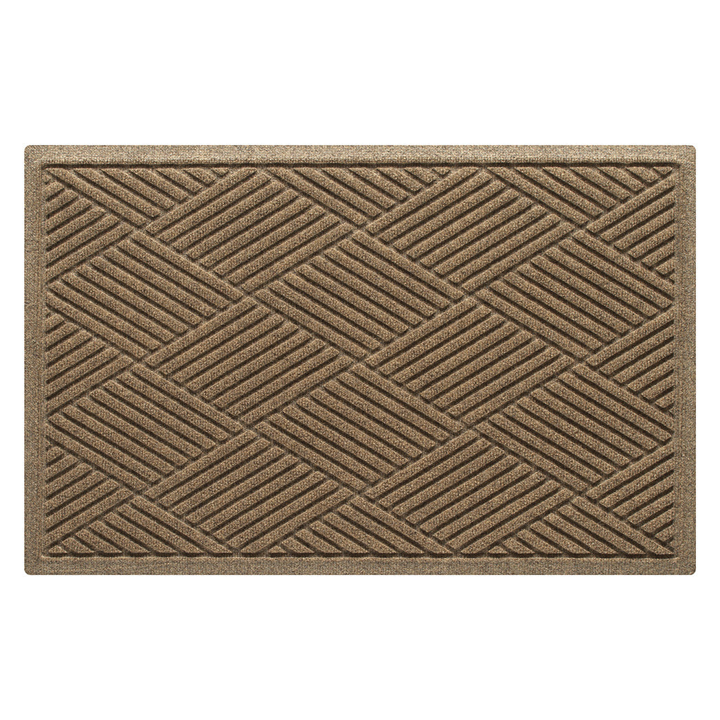 Overhead of a medium Diamonds WaterHog indoor/outdoor doormat in a light tan color and crisscrossing linear design.