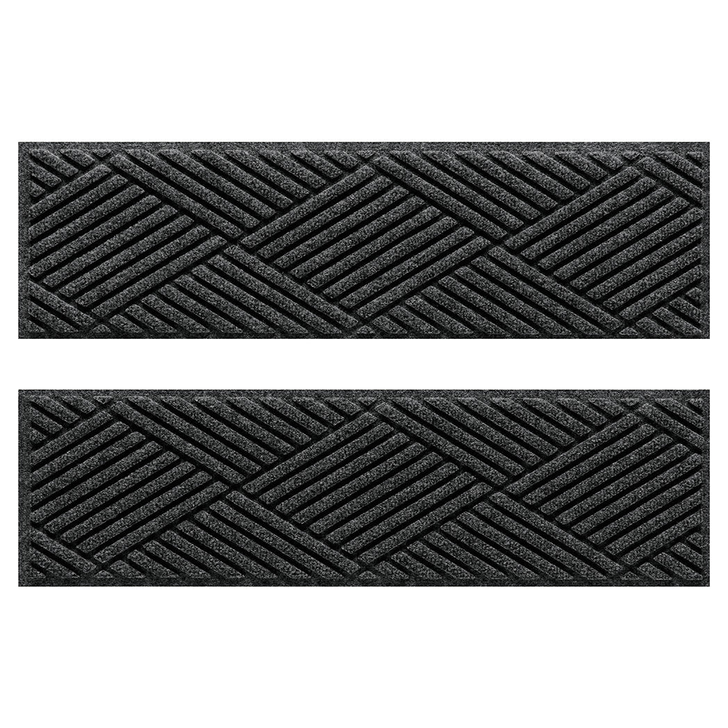 Pair of WaterHog Diamonds modern stair treads with a deep grey crisscrossing linear, bi-level design.