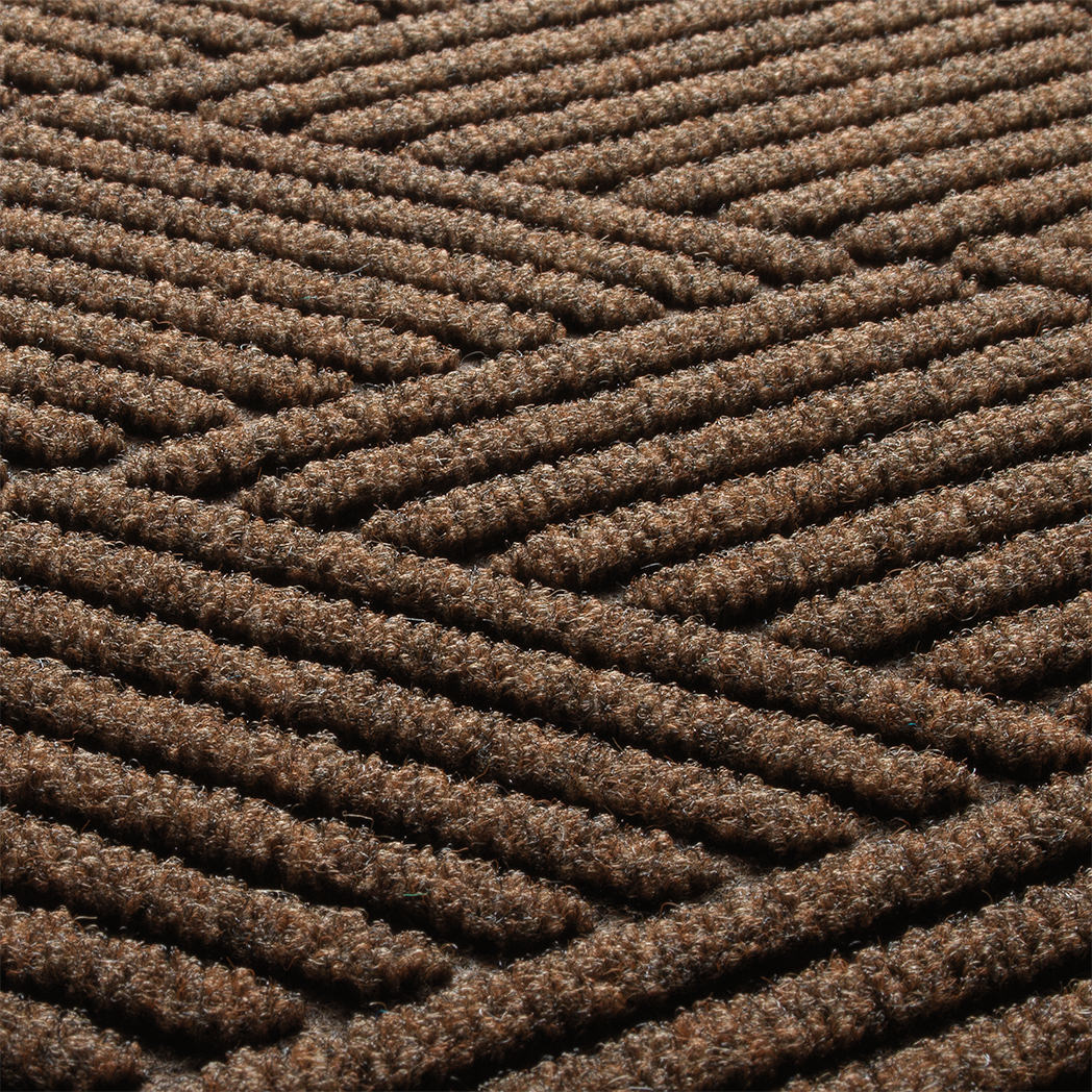 Detail shot of Diamond's surface made of light and dark brown, white, and black fibers.