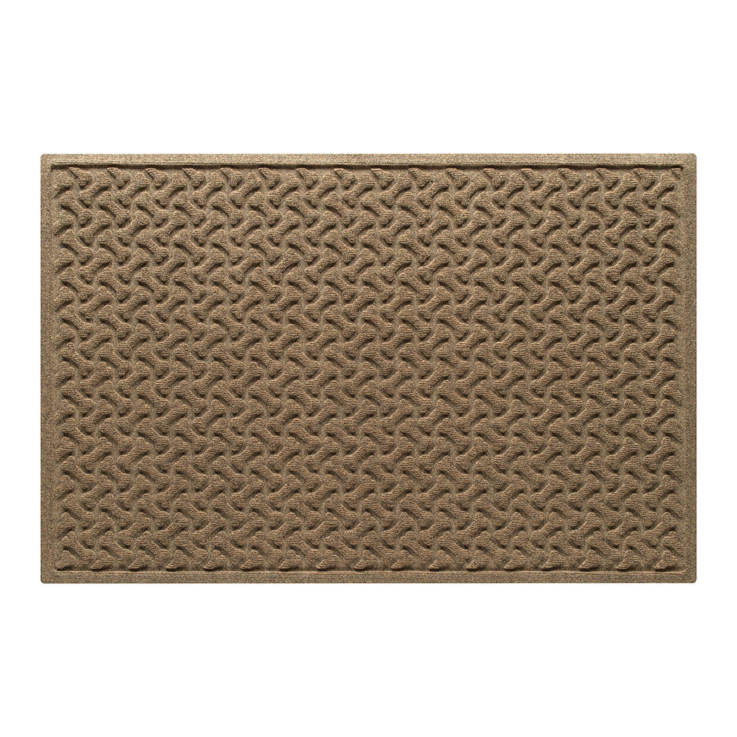 Overhead of a large WaterHog indoor/outdoor doormat with a light tan, repeating pet bones, an American-made mat.