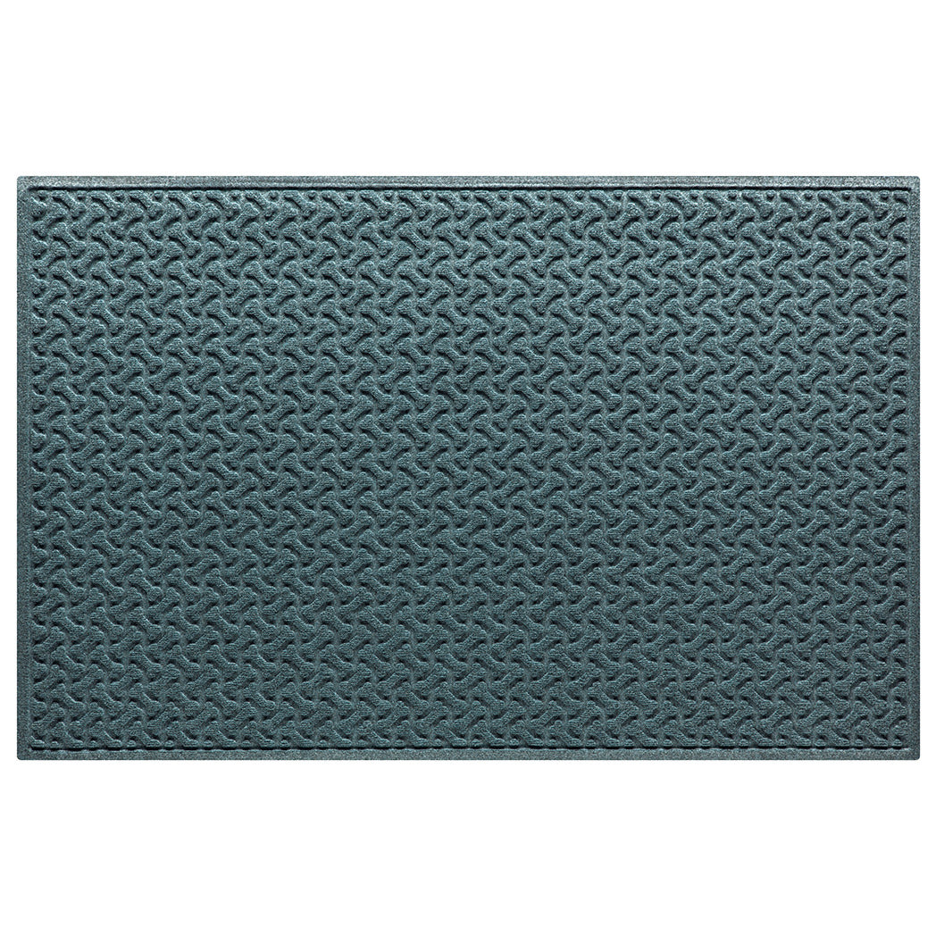 Overhead of a WaterHog XL Dog Bones doormat in a light blue/grey surface and repeating pet bone pattern.