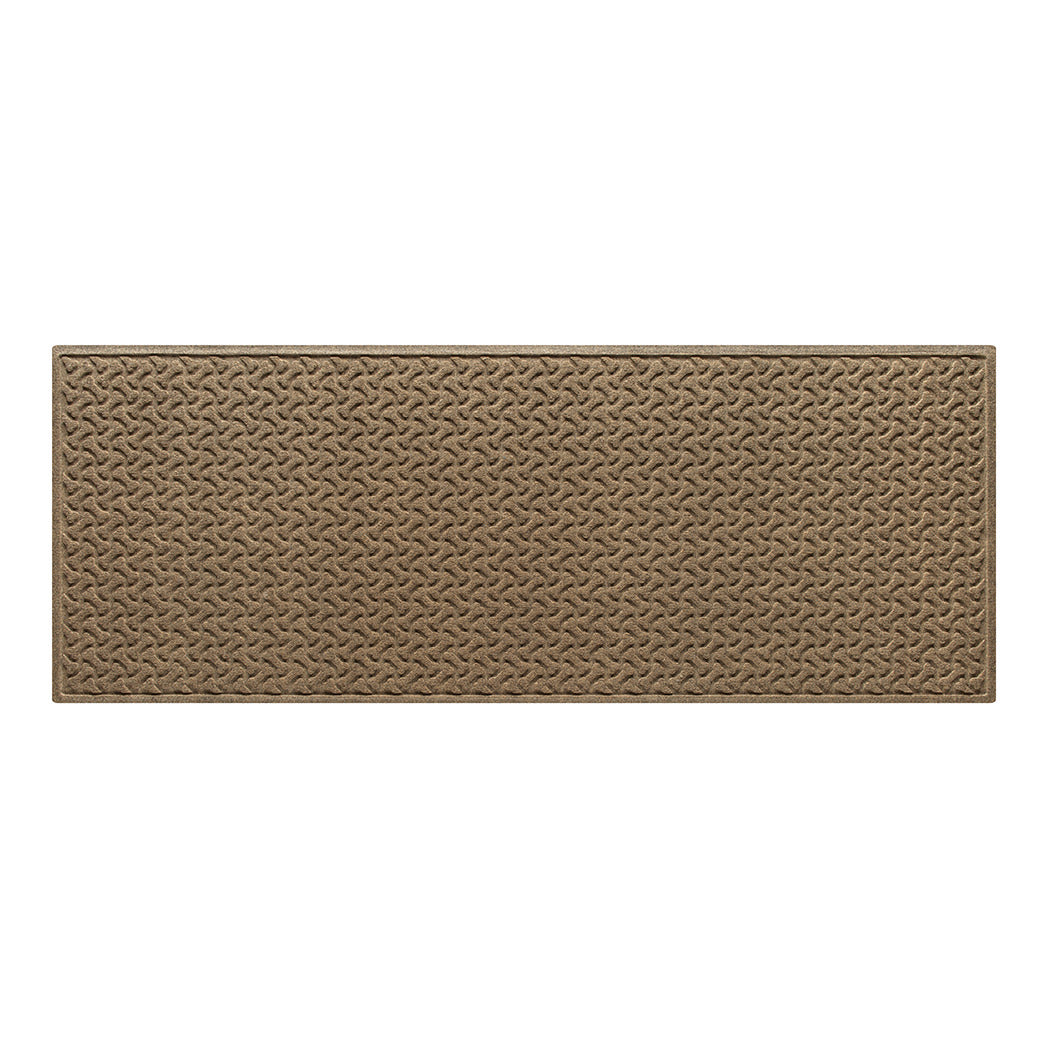 An OG WaterHog indoor/outdoor Dog Bones medium runner with a light tan, water-resistant surface.