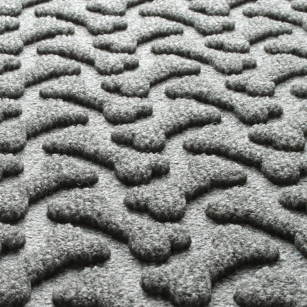 Zoomed in view of Dog Bone's fade-resistant surface creating a light grey, long-lasting mat.