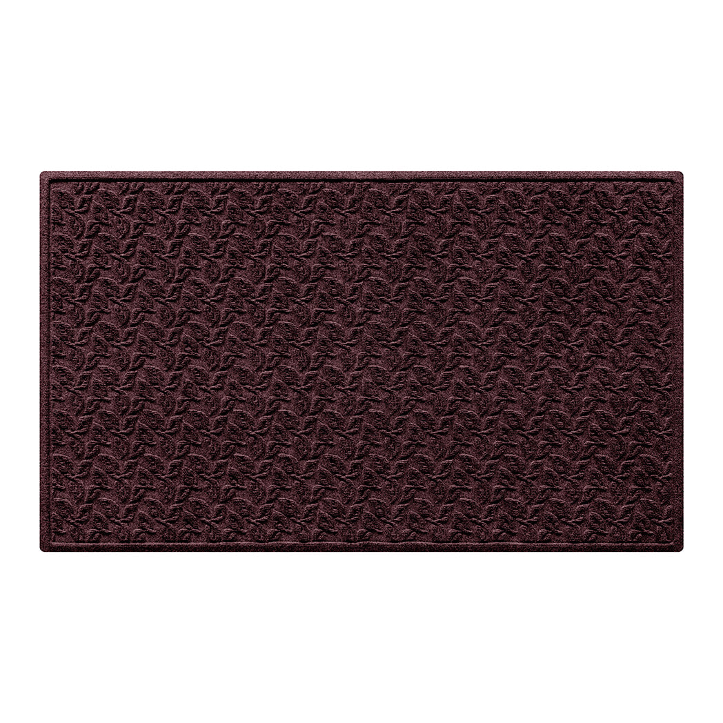 wine-red WaterHog doormat with a repetitive leafy surface on a white background