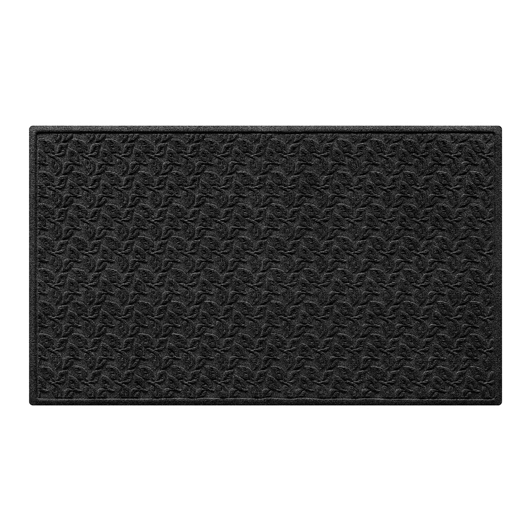 A deep charcoal doormat with a dogwood leaf pattern backed by slip-resistance backing