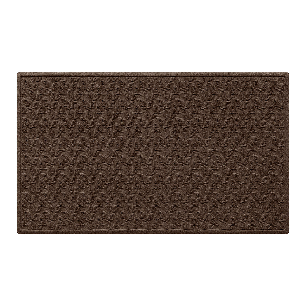 brown large doormat with eco-friendly raised surface of leafy pattern on a white background