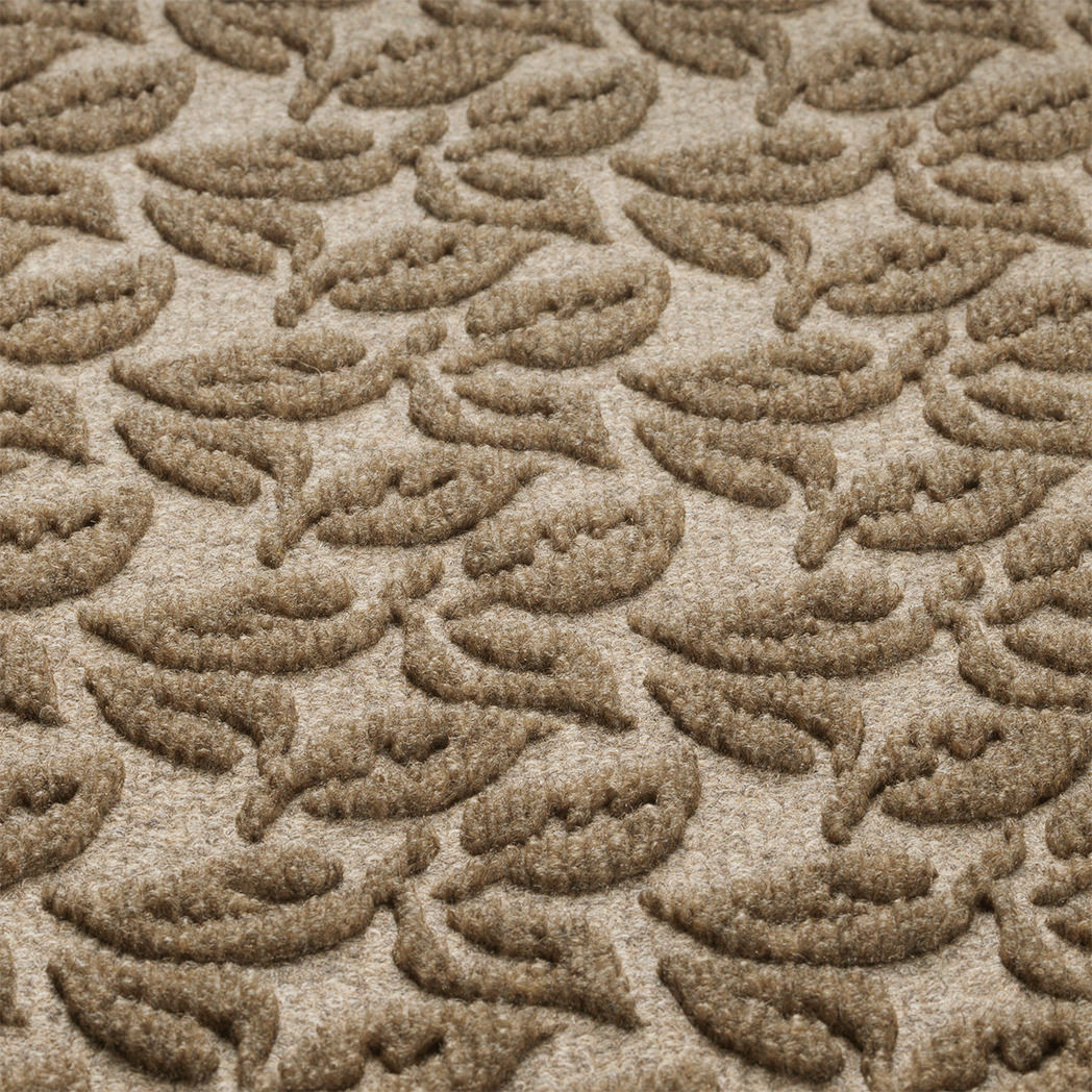 Close-up of the fade-resistant, eco-friendly WaterHog surface making a bi-level leaf pattern