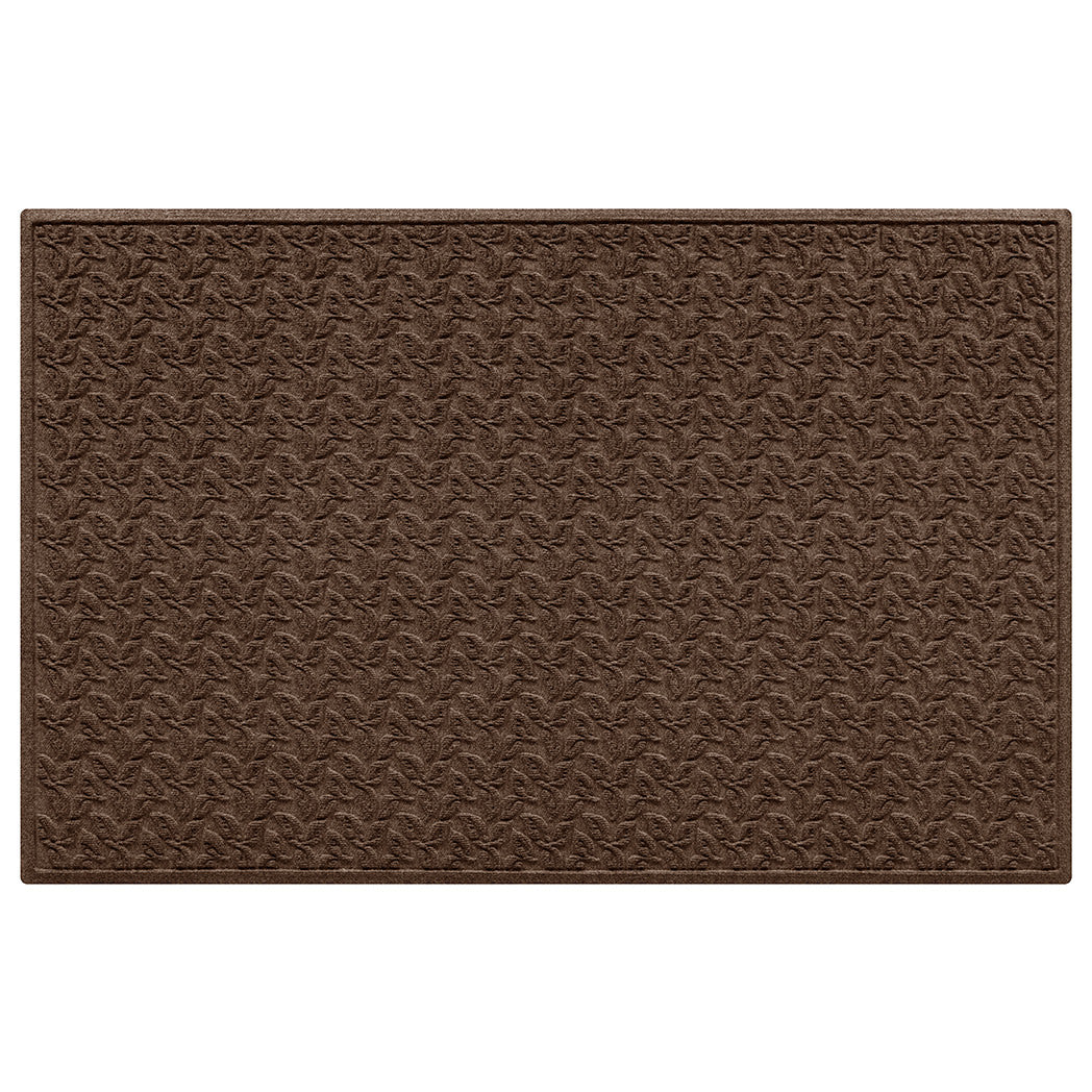 Large stain-resistant doormat in dark brown with dogwood leaf pattern with bi-level surface on a white background