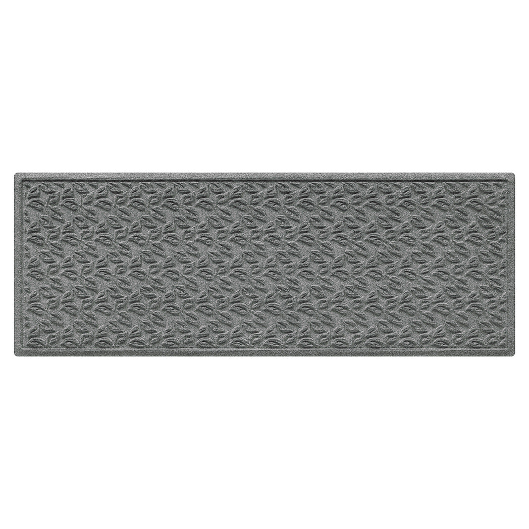 All-weather runner doormat with a repetitive dogwood leaf pattern in m medium grey on a white background