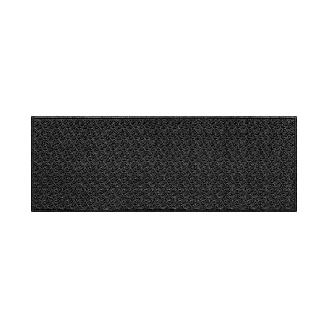 3x8 dark grey, charcoal dogwood leaf pattern runner mat on a white background