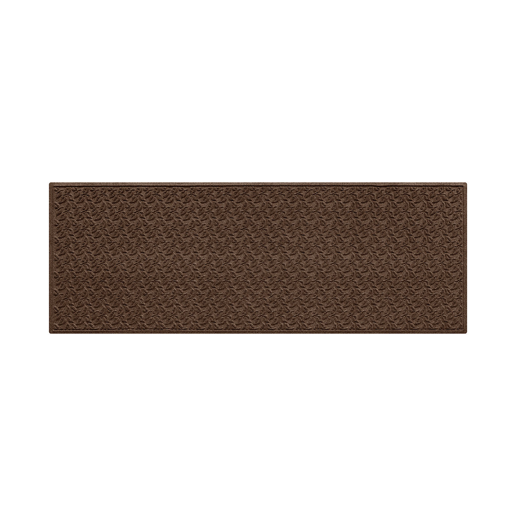 Dark brown all-weather runner doormat with a repetitive dogwood leaf pattern on a white background