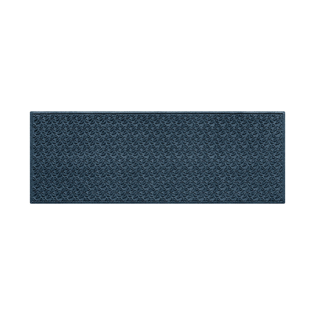 Navy blue all-weather runner doormat with a repetitive dogwood leaf pattern on a white background