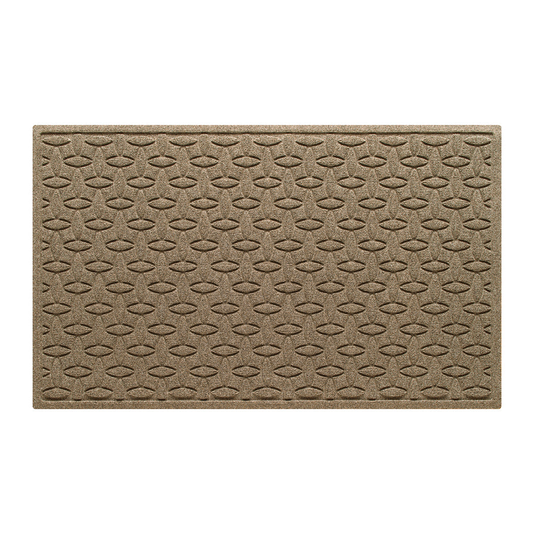 An OG WaterHog 3x5 indoor/outdoor doormat in a light tan interlocking elliptical design; an American-made mat.