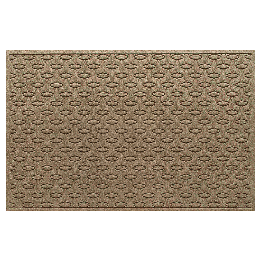 An OG WaterHog 4x6 indoor/outdoor doormat in a light tan interlocking elliptical, bi-level design.