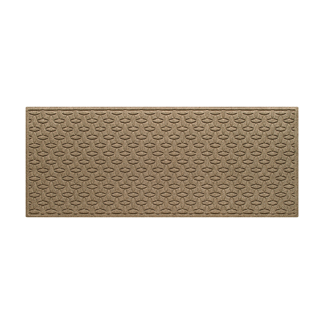 An OG WaterHog indoor/outdoor medium runner in a light tan interlocking elliptical, bi-level design.