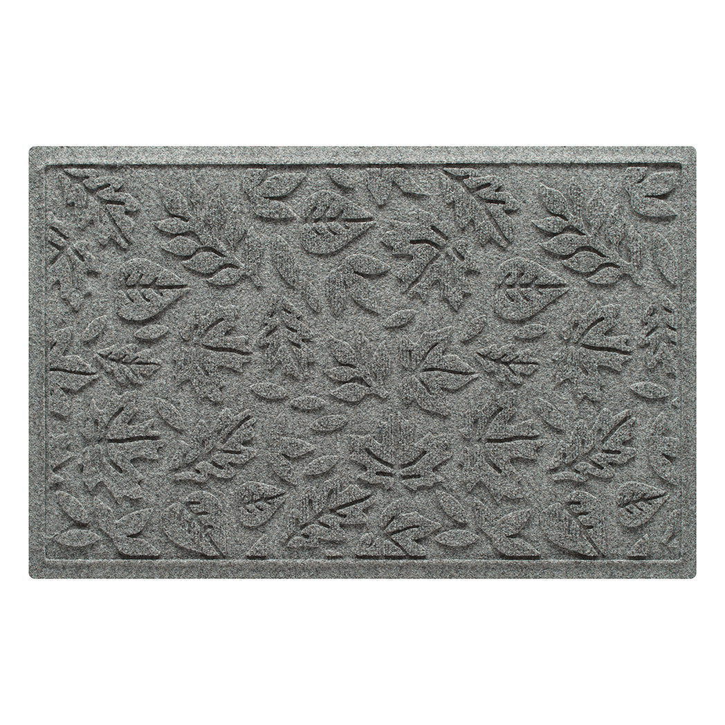 Overhead of a WaterHog medium-sized premium doormat in a light grey color with a fallen leaves, bi-level pattern.