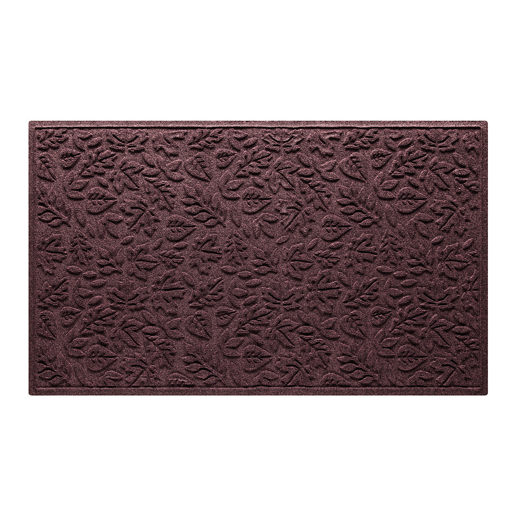 Overhead of a large Fall Day all-weather door mat in a deep wine red color with a fallen leaves, bi-level design.