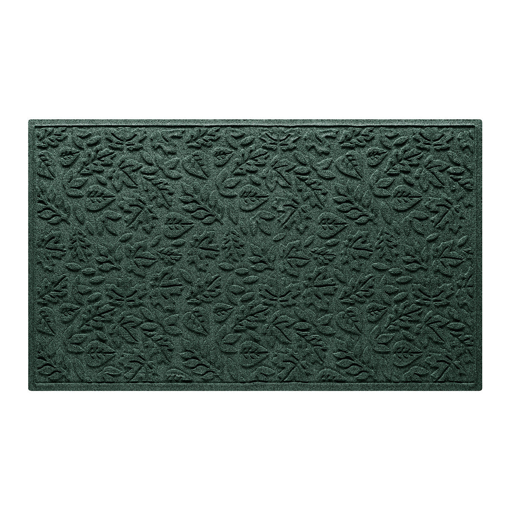 An authentic WaterHog large premium door mat with a deep green surface and fallen leaves pattern.