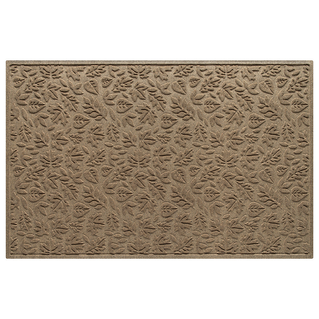 An OG WaterHog 4x6 indoor/outdoor doormat in a light tan fallen leaves design; an American-made mat.