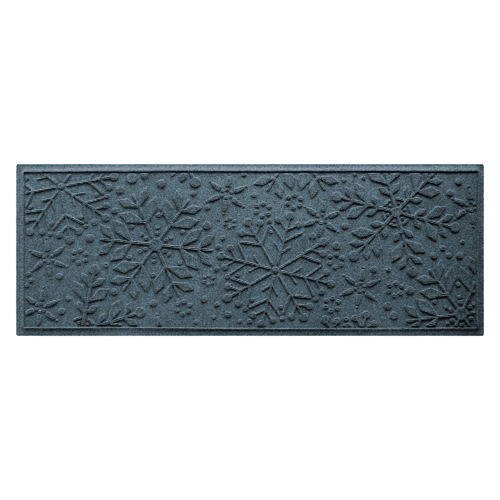 Textured blue doormat with snowflake pattern on a white background