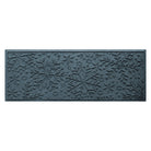 Textured blue doormat with snowflake pattern on a white background