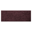 Deep red wine colored doormat runner with snowflake pattern on a white background