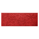 Bright red doormat runner with snowflake pattern on a white background