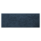 Navy blue doormat with snowflake pattern on a white background