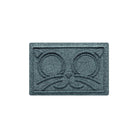 Overhead of a small WaterHog Kitty Face bowl mat in a light blue/grey surface.
