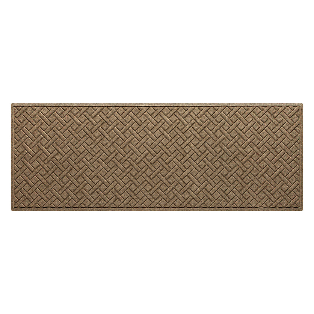 An OG WaterHog indoor/outdoor medium runner in a light tan surface, and durable rubber backing.