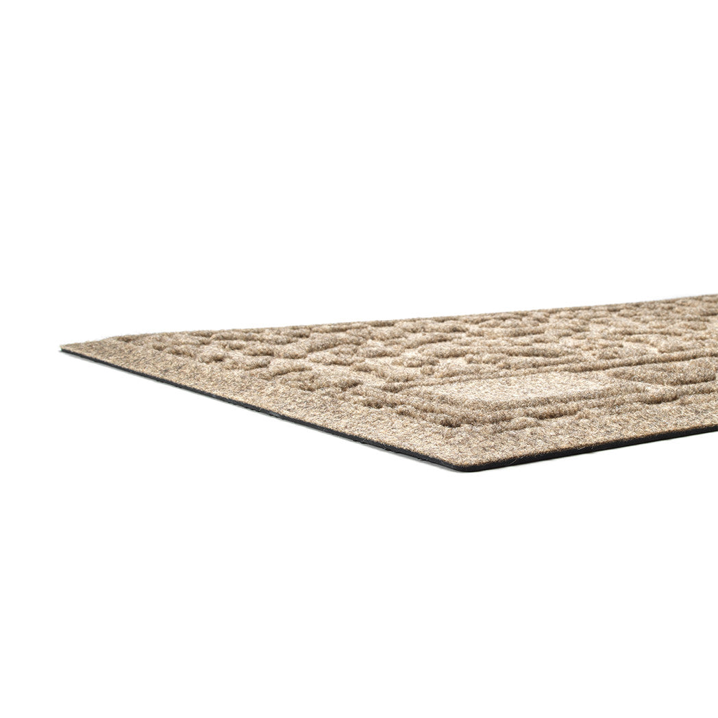 Close up of WaterHog's personalized Paws & Bones bowl mat; water dam, low-profile border and rubber backing.