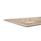 Close up of WaterHog's personalized Paws & Bones bowl mat; water dam, low-profile border and rubber backing.