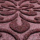 A close-up shot of the WaterHog Pheonix Indoor/Outdoor doormat in a burgundy, displaying the mixture of dark red, grey, and white carpeted fibers that make up the top of the mat.