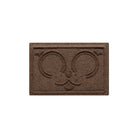 A 12x18 WaterHog Puppy Face bowl mat overhead, in a dark earthy brown surface.