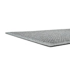 A low and close shot of Square's low-profile edge, bi-level surface, and rubber backing, all on a white background.